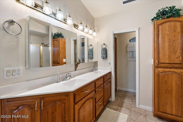 977 Kristin St, Chino Valley, AZ 86323 - bathroom with double vanity, a shower with shower door, and tile patterned flooring