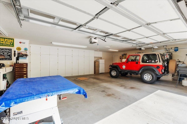 977 Kristin St, Chino Valley, AZ 86323 - garage with freestanding refrigerator and a garage door opener