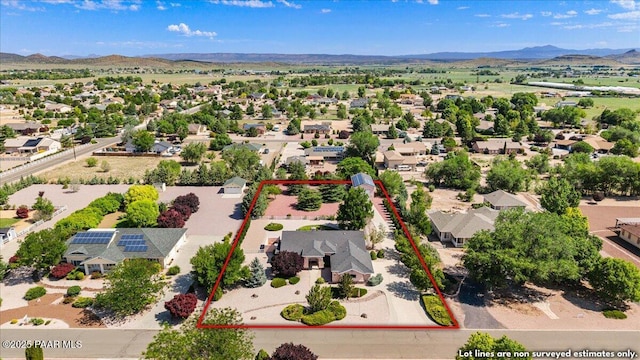 977 Kristin St, Chino Valley, AZ 86323 - aerial view of residential area featuring a mountainous background and property boundaries highlighted
