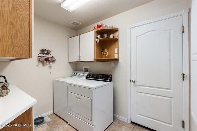 977 Kristin St, Chino Valley, AZ 86323 - laundry room with cabinet space, washer and dryer, and light tile patterned floors