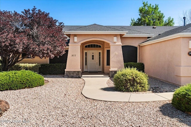 977 Kristin St, Chino Valley, AZ 86323 - property entrance with stucco siding and roof with shingles