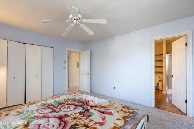 bedroom with ceiling fan, a closet, and light carpet