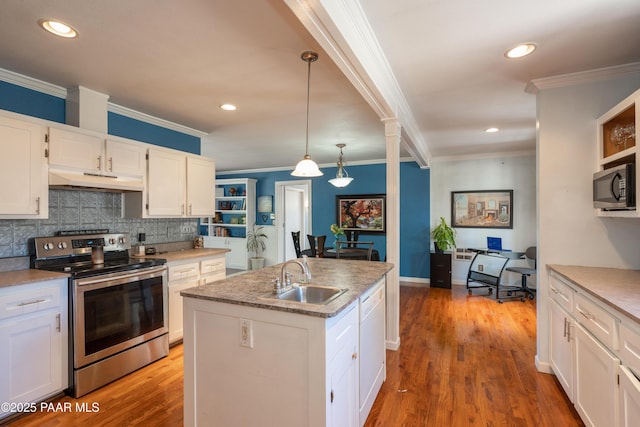 kitchen featuring a sink, under cabinet range hood, white cabinetry, stainless steel appliances, and crown molding