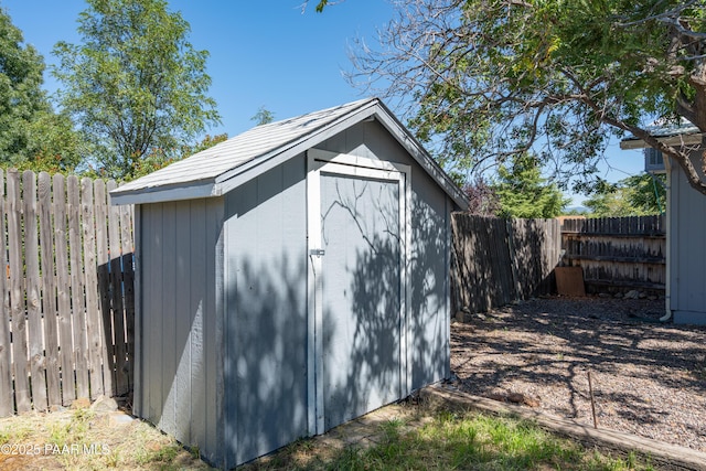 view of shed featuring a fenced backyard