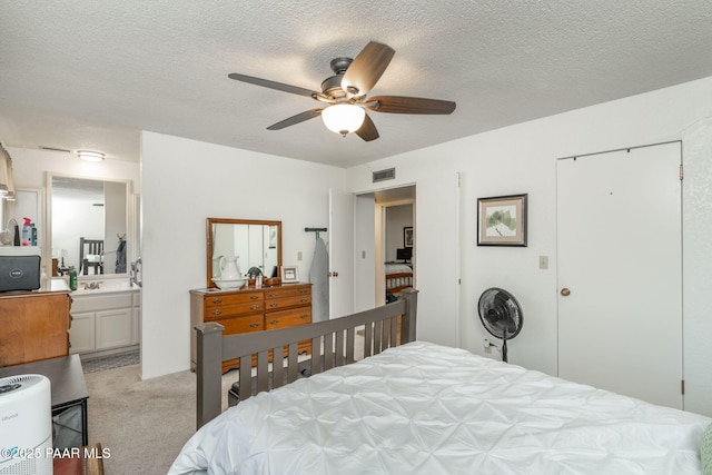 11009 E Lariat Ln, Dewey-Humboldt, AZ 86327 - bedroom featuring light colored carpet, a textured ceiling, and a ceiling fan