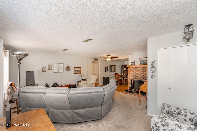 11009 E Lariat Ln, Dewey-Humboldt, AZ 86327 - living room featuring a ceiling fan, a textured ceiling, and light colored carpet
