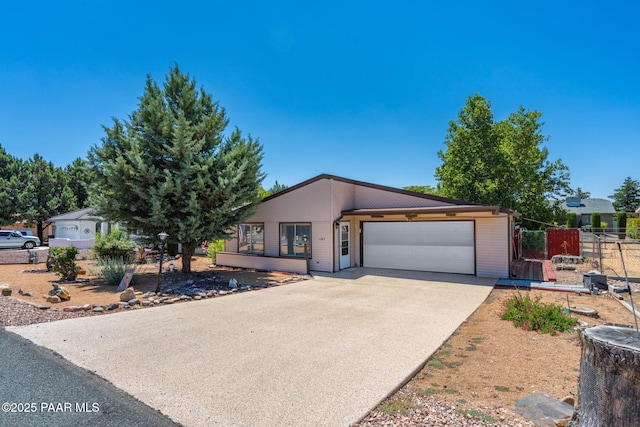 11009 E Lariat Ln, Dewey-Humboldt, AZ 86327 - view of front facade featuring an attached garage and concrete driveway