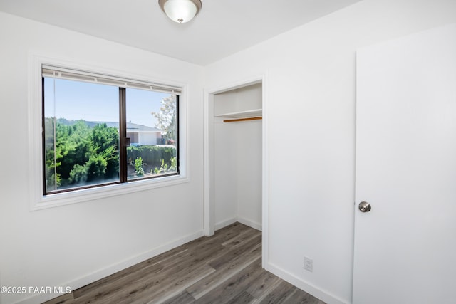 3924 N Taylor Dr, Prescott Valley, AZ 86314 - unfurnished bedroom with wood finished floors and baseboards