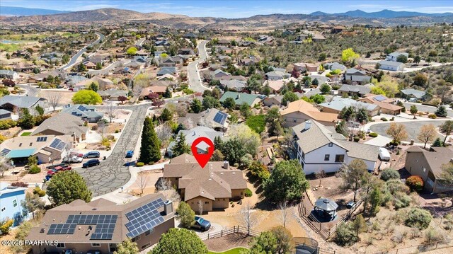 birds eye view of property with a mountain view and a residential view