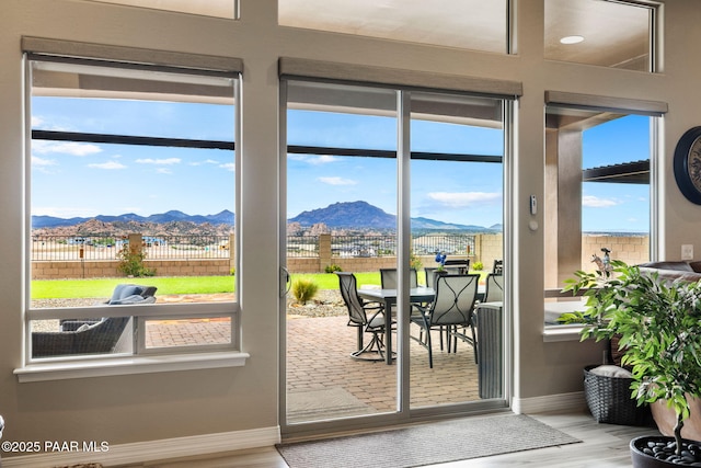 5242 High Cliff Way, Prescott, AZ 86301 - doorway featuring a mountain view, baseboards, and wood finished floors