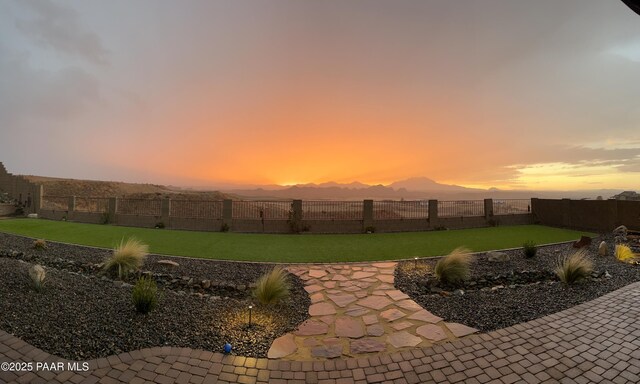 5242 High Cliff Way, Prescott, AZ 86301 - patio terrace at dusk featuring a fenced backyard and a mountain view