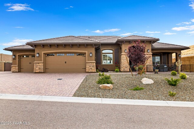5242 High Cliff Way, Prescott, AZ 86301 - prairie-style home with stone siding, decorative driveway, a garage, and stucco siding