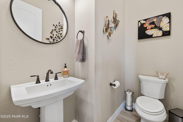 5242 High Cliff Way, Prescott, AZ 86301 - half bath with toilet, baseboards, a sink, and wood finished floors