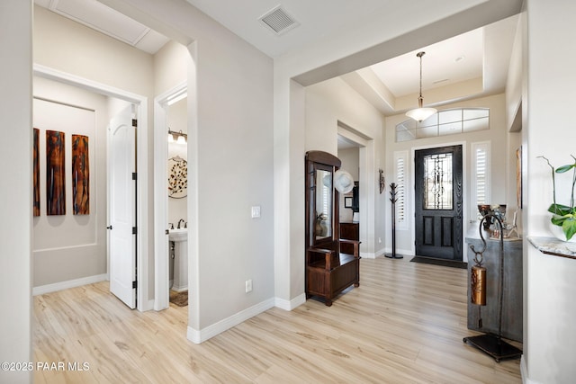 5242 High Cliff Way, Prescott, AZ 86301 - entryway featuring light wood-style flooring, baseboards, and a raised ceiling