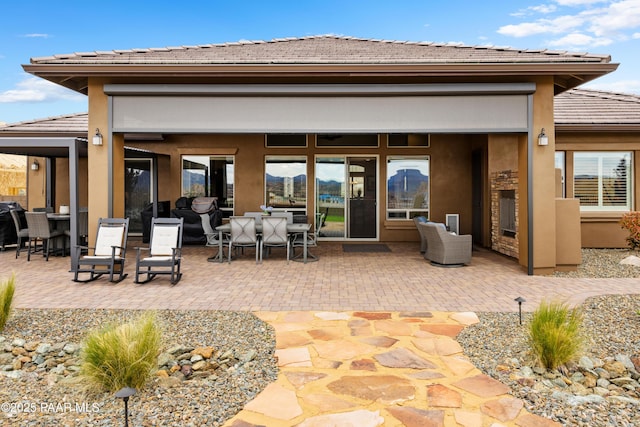 5242 High Cliff Way, Prescott, AZ 86301 - back of property with a tiled roof, outdoor dining space, a patio area, and stucco siding