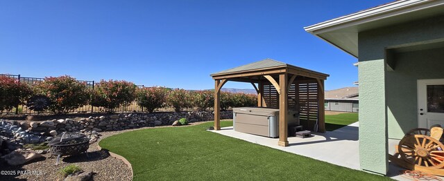 view of yard with a patio, a gazebo, and a fenced backyard