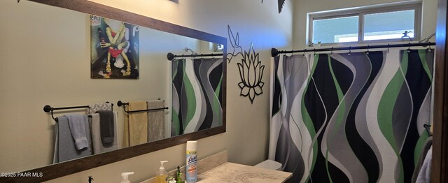full bathroom with vanity and a shower with curtain