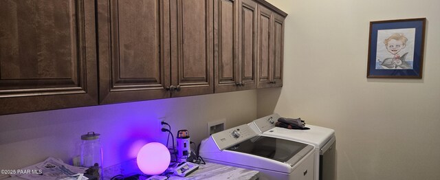 laundry area featuring cabinet space and washer and clothes dryer