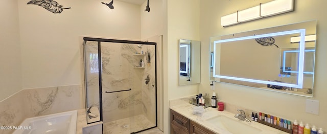 bathroom with a marble finish shower, a tub, and vanity