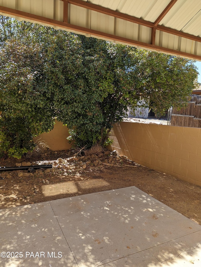 exterior space featuring a patio and fence