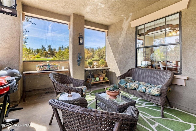 sunroom / solarium with plenty of natural light and an outdoor living space
