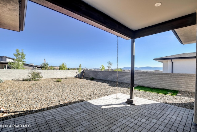 view of patio / terrace featuring a mountain view