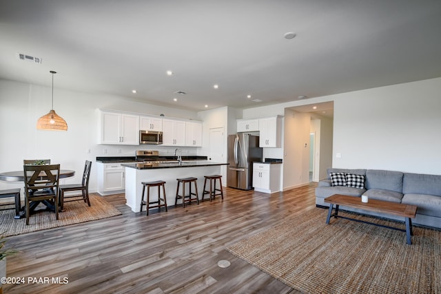 living room with wood-type flooring and sink