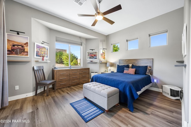 bedroom with wood-type flooring and ceiling fan