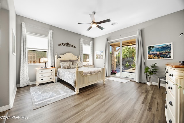 bedroom featuring ceiling fan, access to exterior, and wood-type flooring