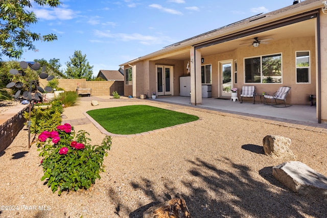 back of house featuring ceiling fan and a patio area