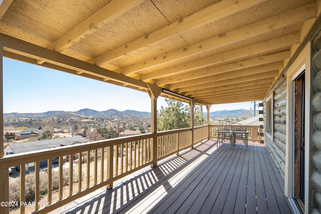 wooden deck with a mountain view