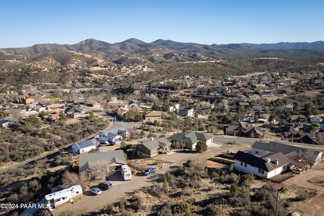 birds eye view of property with a mountain view