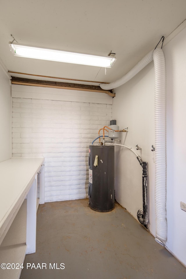 utility room featuring electric water heater