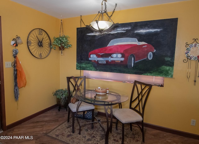 dining space featuring dark hardwood / wood-style floors