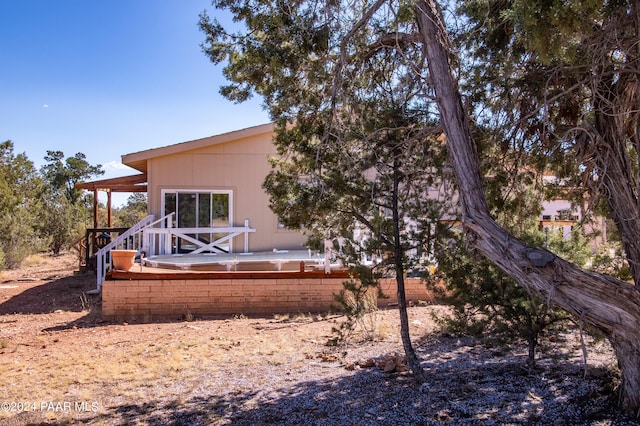 rear view of house with a deck