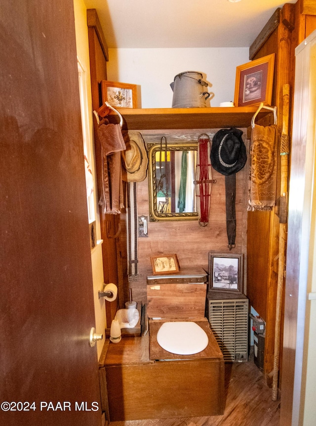 bathroom with hardwood / wood-style floors