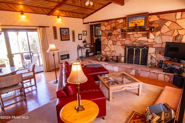 living room featuring a stone fireplace, lofted ceiling with beams, heating unit, light hardwood / wood-style floors, and wood ceiling