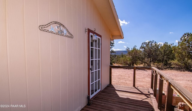 wooden balcony featuring a deck