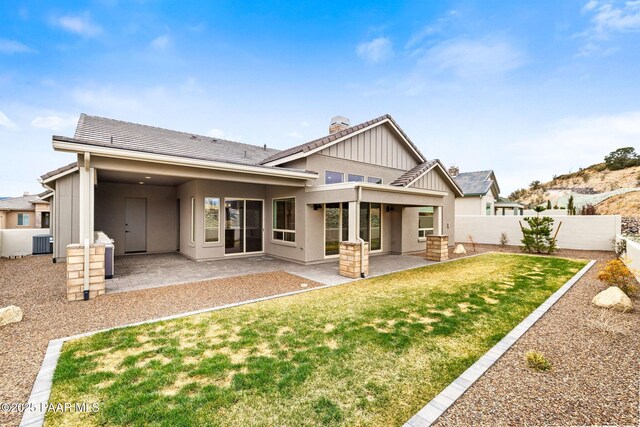 1148 S Lakeview Dr, Prescott, AZ 86301 - rear view of house with cooling unit, a patio area, a lawn, and a fenced backyard
