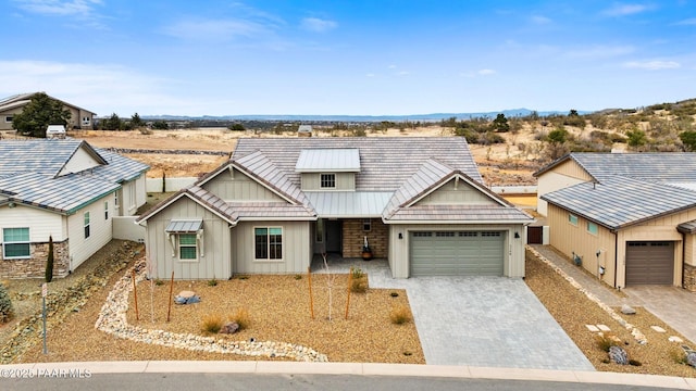 1148 S Lakeview Dr, Prescott, AZ 86301 - view of front of property featuring board and batten siding, metal roof, decorative driveway, and a garage