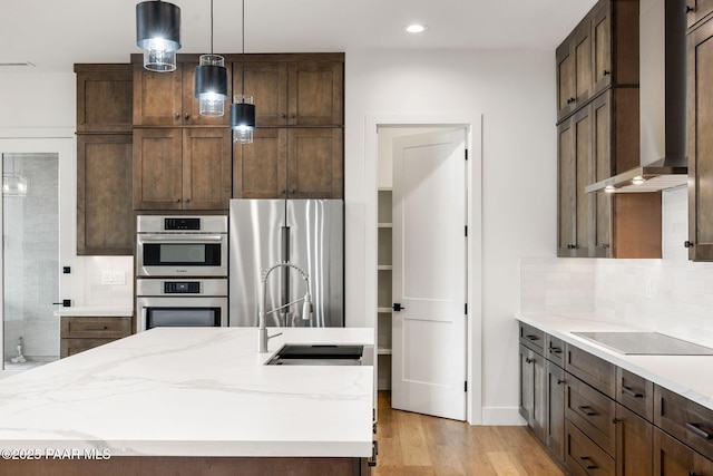 1148 S Lakeview Dr, Prescott, AZ 86301 - kitchen featuring tasteful backsplash, wall chimney range hood, light wood-type flooring, appliances with stainless steel finishes, and a sink