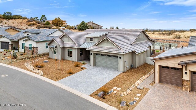 1148 S Lakeview Dr, Prescott, AZ 86301 - view of front of house featuring a garage, board and batten siding, and driveway