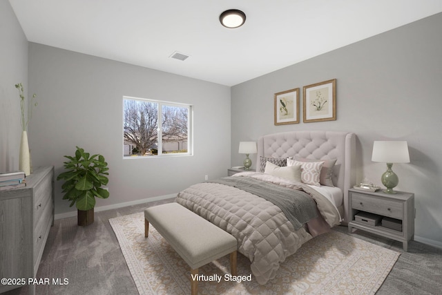 bedroom featuring baseboards, visible vents, and carpet floors