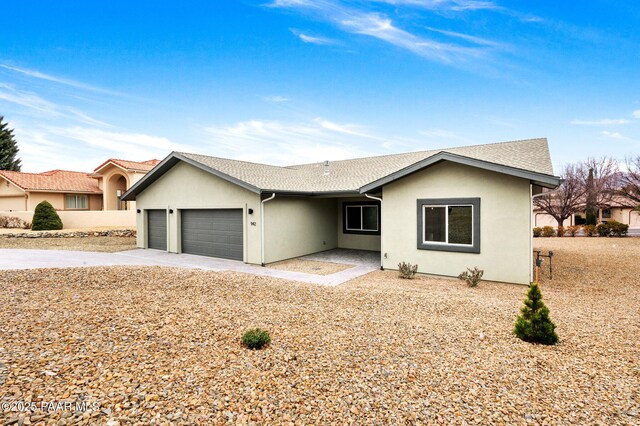 ranch-style house featuring a garage