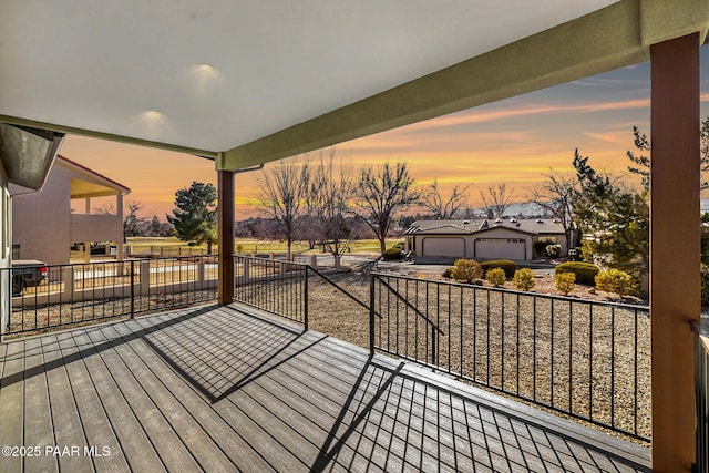 wooden terrace featuring an outdoor structure