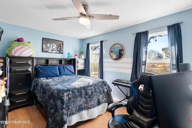 bedroom featuring ceiling fan and wood-type flooring