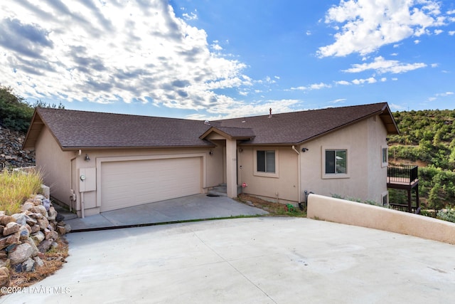 ranch-style home featuring a garage