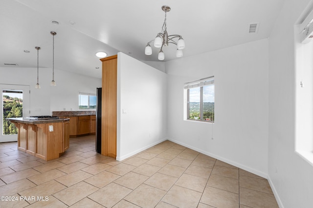 720 E Sky Terrace Dr, Prescott, AZ 86303 - kitchen with light tile patterned floors, a notable chandelier, a wealth of natural light, and visible vents