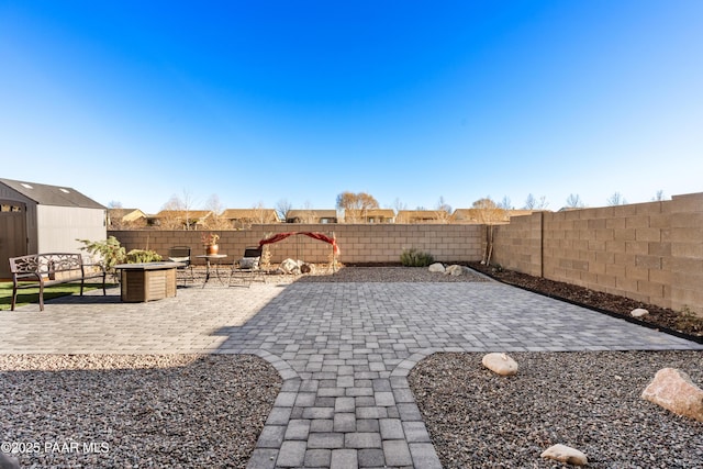 view of patio / terrace featuring an outdoor fire pit