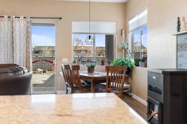 dining space with dark hardwood / wood-style flooring